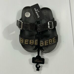 67. NWT Girls Bebe Glittery Black and Gold‎ Slides